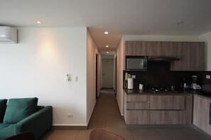 Suite, Balcony, City View | Living area - Paralelo Obispado (Monterrey)