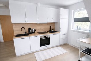 Private kitchen - Modern, central apartment for up to 4 people right next to the old lighthouse (Borkum)