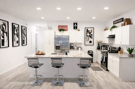 Private kitchen. Spacious 5BR Home • Sleeps 10 • Fenced Yard