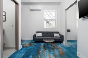Executive Suite | Living area | 43-inch Smart TV with digital channels, Netflix, streaming services - Plush Hotel (toronto)