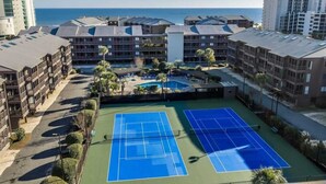 A multi-story hotel with a tennis court, pool, and ocean view. - Tilghman Beach & Racquet Club 224 (North Myrtle Beach)