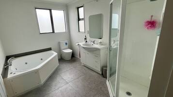Shower, towels, soap, toilet paper