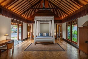 A spacious bedroom with a large bed, wooden ceiling, and large windows with a view of greenery. - The Sira, a Luxury Collection Resort & Spa, Lombok (Tanjung)