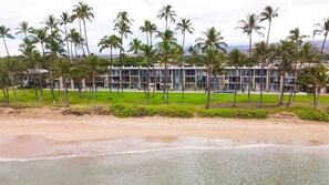 On the beach, sun-loungers, beach towels - Oceanfront Kihei Condo • Stunning Sunsets •  Beach Access •  Maui Getaway (Kihei)