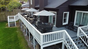 A deck with outdoor furniture, a staircase, and a view of the house. - Beautiful Masters Rental, 3 Miles from Augusta National Golf Course (Augusta)