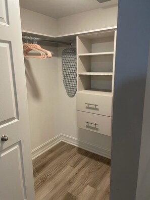 A walk-in closet with hanging space, shelves, and drawers. - Luxury Prime Brickell Condo, Pool, Gym, Free Parking (Miami)