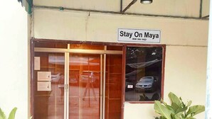 A building entrance with a sign reading 'Stay On Maya.' - Stay On Maya (Chiang Mai)