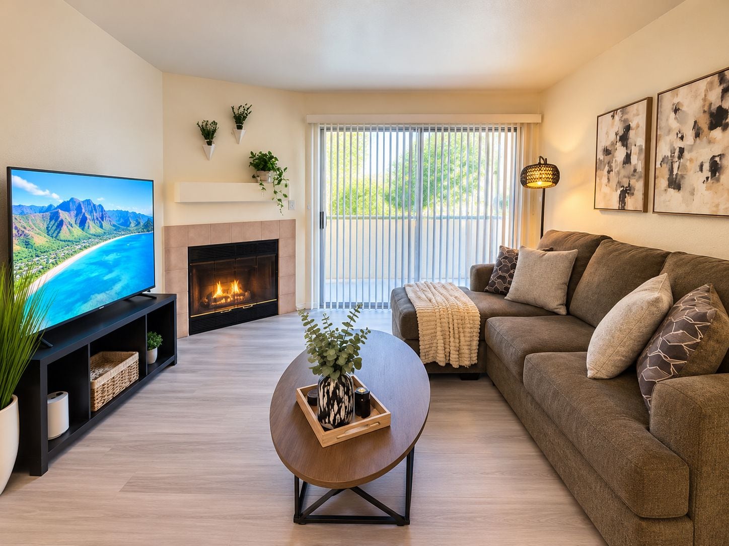 A living room with a fireplace, a television, a sofa, and a coffee table.