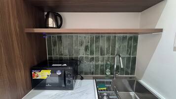Fridge, microwave, stovetop, cookware/dishes/utensils