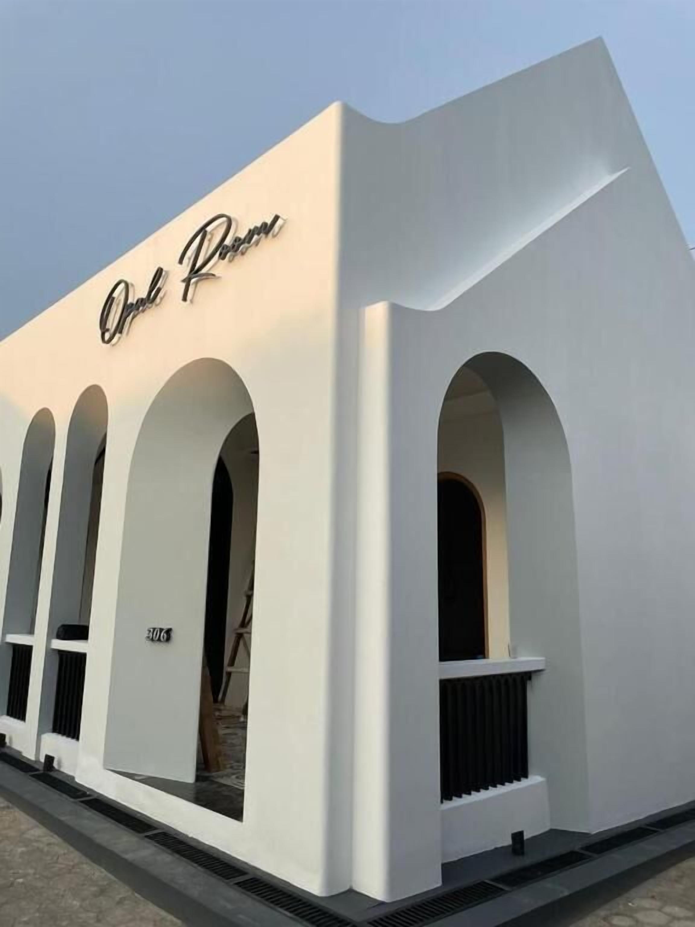 A white building with the name 'Oral Room' and a number '306' on the side.
