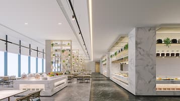 A modern hotel lobby with a marble reception desk, seating area, and a view of the sky through large windows.