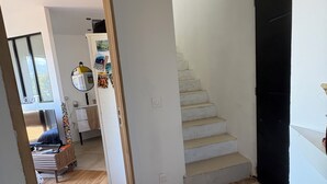 A modern interior with a staircase, wooden flooring, and a view of a balcony. - 🌿 Charming house with jacuzzi & open view - Haven of peace 🌞 (Bastelicaccia)