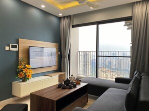 Quarto duplo luxo, vista para a cidade | Área de estar