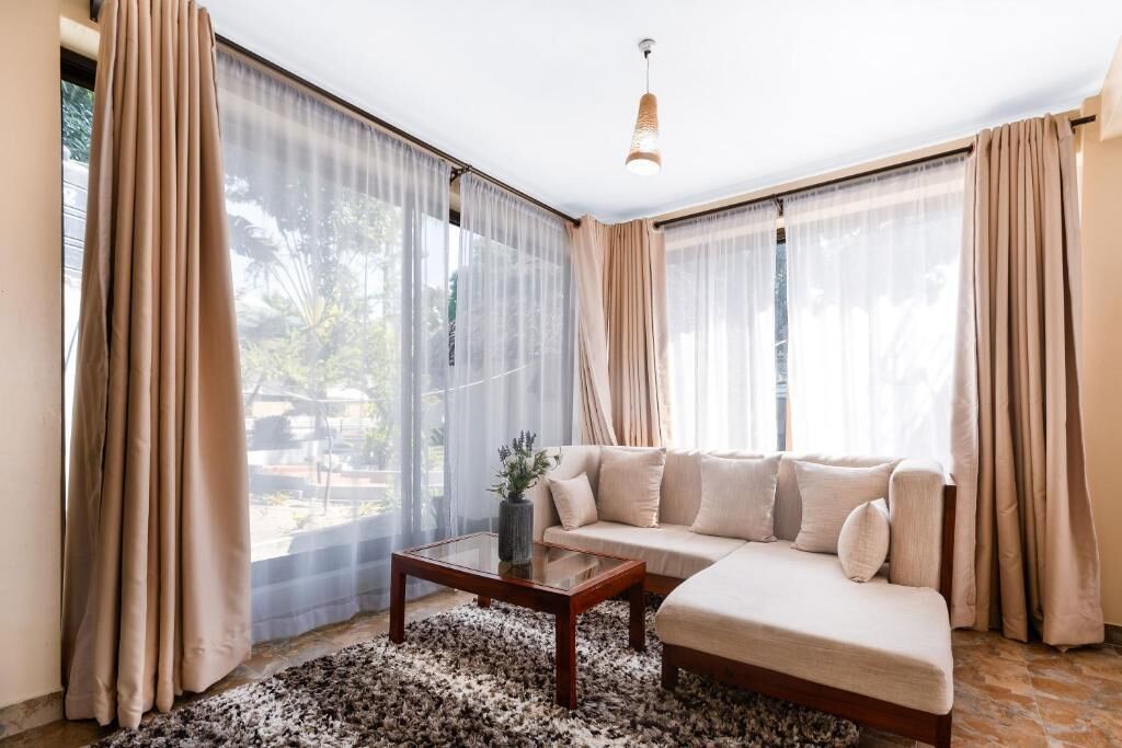 Doppia Deluxe, patio, vista giardino | Area soggiorno