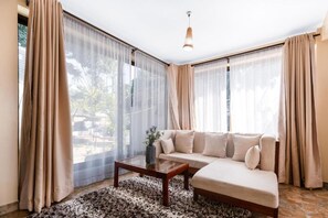 Deluxe Double Room, Patio, Garden View | Living area - Ingoo Club (Dar es Salaam)