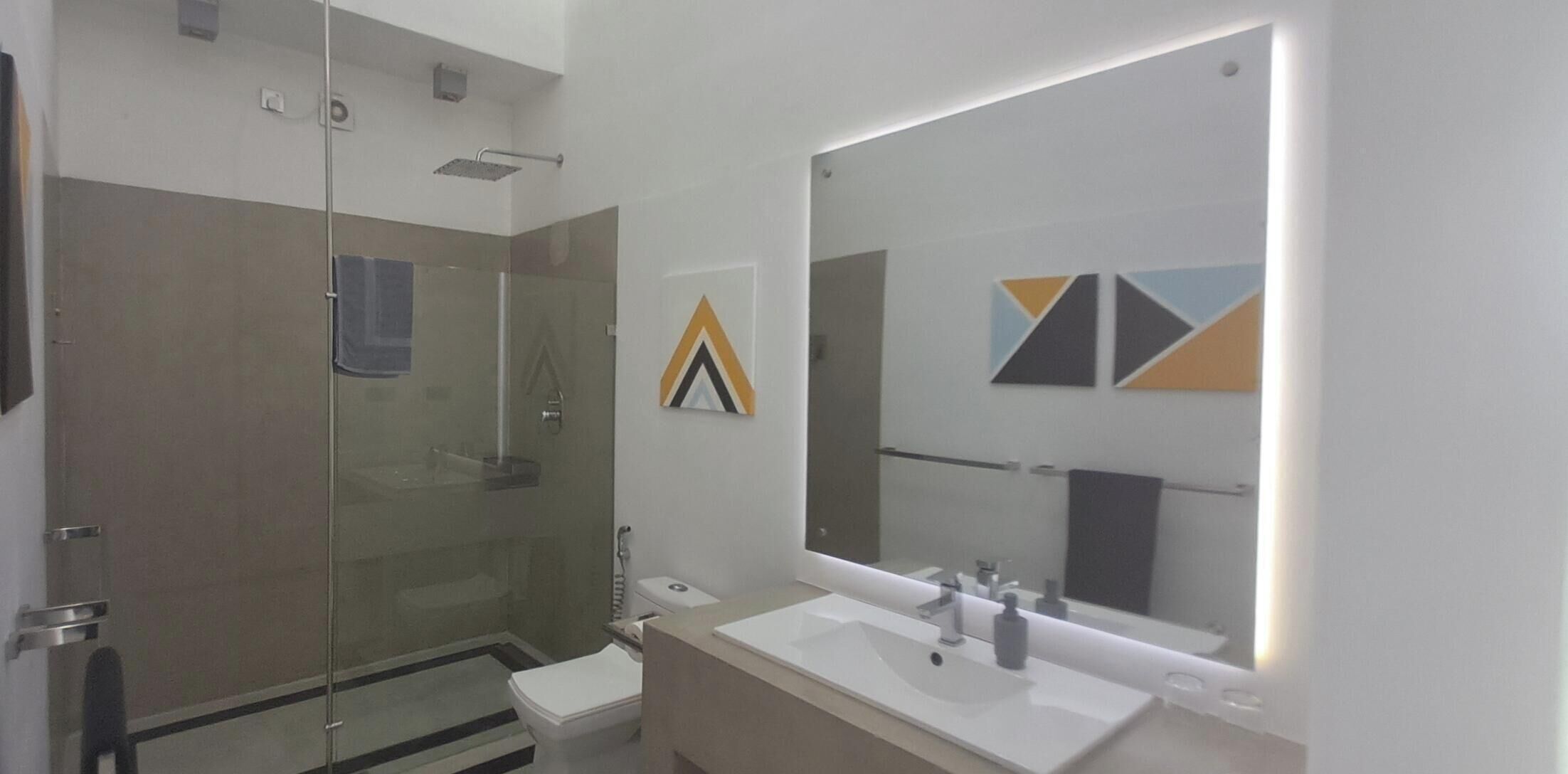 Deluxe Suite, Sea View, Beachfront | Bathroom | Shower, hair dryer, towels, soap