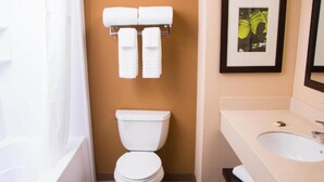 A bathroom with a toilet, a sink, and a shower. - 1 King Bed | Non-Smoking, Kitchen, Shower (Chicago)
