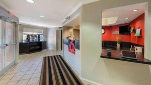 A hotel lobby with a reception desk, a coffee station, and a striped carpet. - 2 Queen Beds |Non- Smoking, Kitchen (Minneapolis MN)