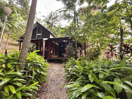 Exterior. Hidden among lush rainforest and towering palms, a charming family retreat