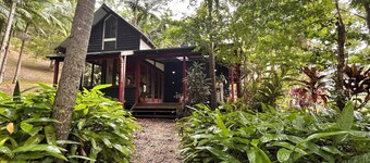 Hidden among lush rainforest and towering palms, a charming family retreat