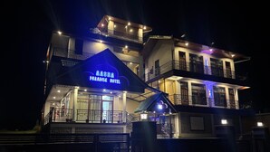 A multi-story hotel with a prominent sign reading 'AASRA PARADISE HOTEL'. - AASRA PARADISE HOTEL (Dharamshala)