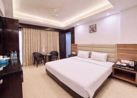 Premium bedding, desk, laptop workspace, soundproofing