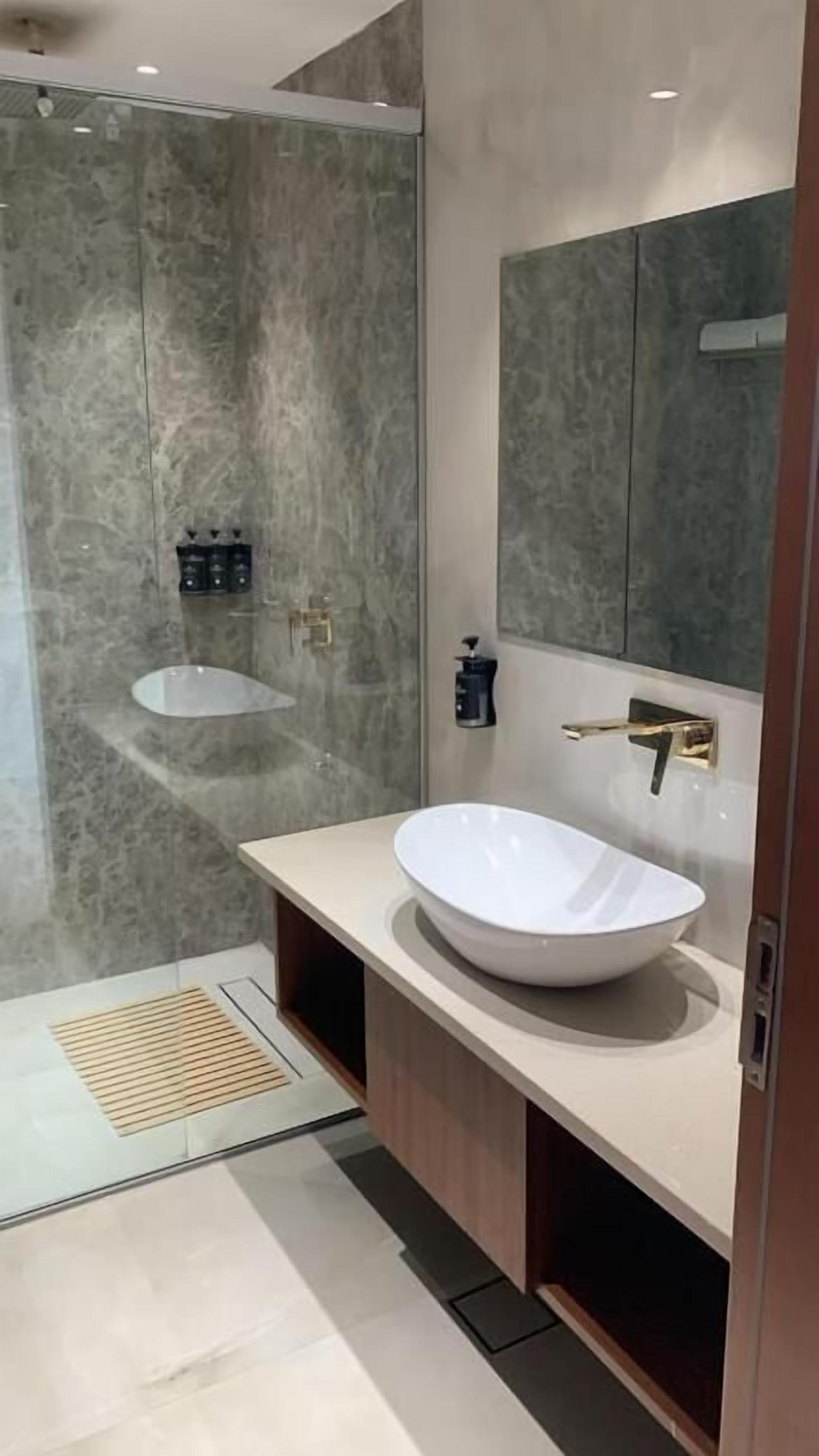 Separate bathtub and shower, hair dryer, slippers, towels
