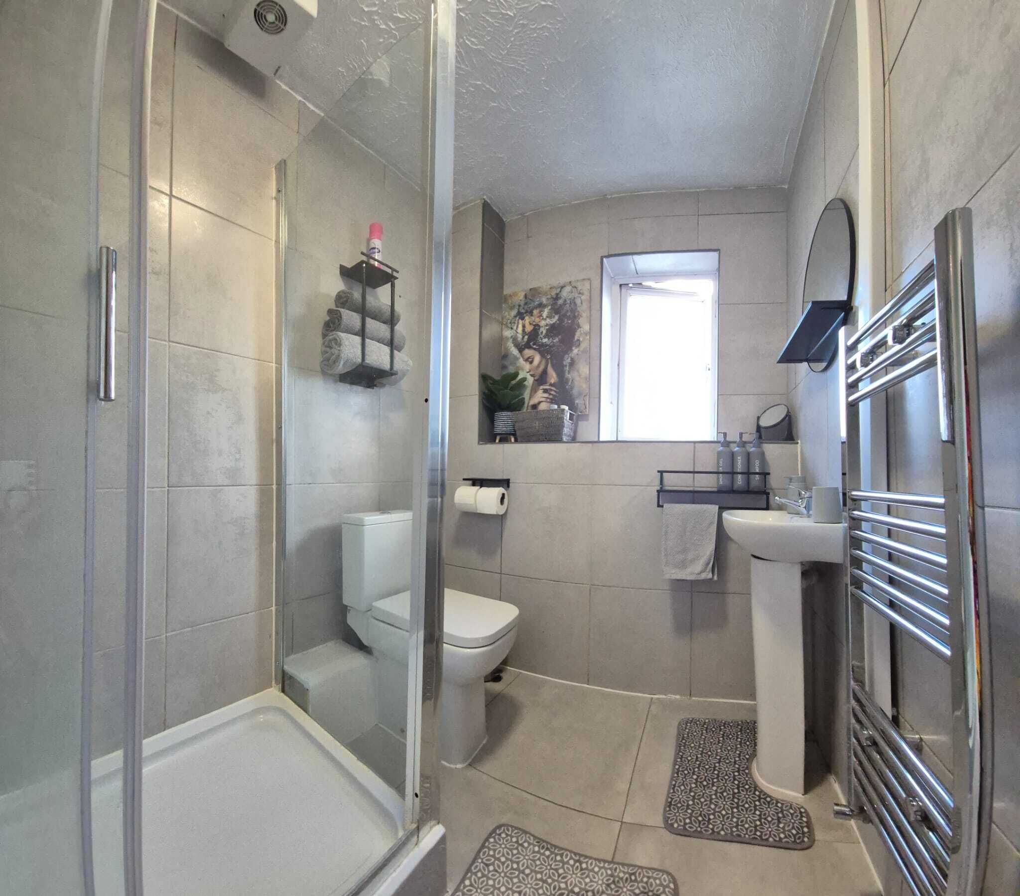 Shower, hair dryer, towels, soap