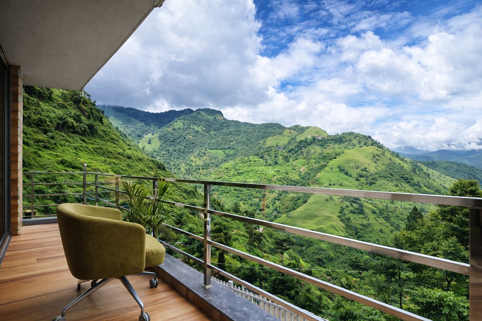 A balcony with a view of lush green hills and a clear sky.