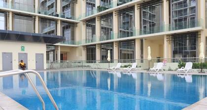 1BR Masdar Getaway | Poolside Living w/ Parking