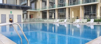 1BR Masdar Getaway | Poolside Living w/ Parking