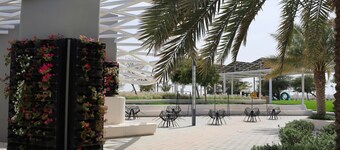 1BR Masdar Getaway | Poolside Living w/ Parking