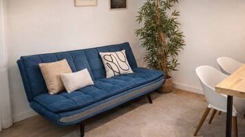 Standard Apartment, Kitchenette | Living area | 32-inch flat-screen TV with satellite channels