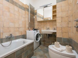 Shower, hair dryer, towels, shampoo - HomeLovers Bright and White House Navigli District (Milano)