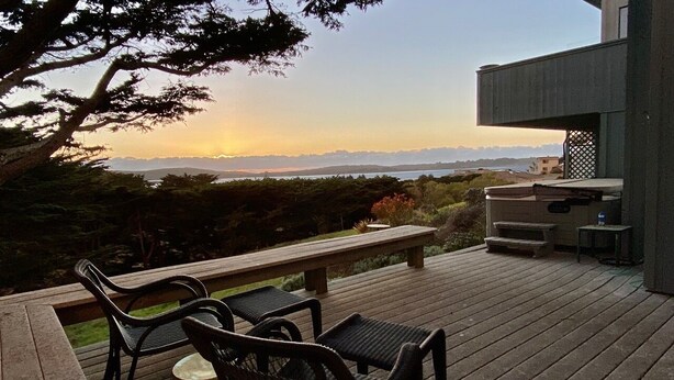 A deck with outdoor furniture, a barbecue area, and a view of the landscape. - Starboard Sunset – Coastal Views, Hot Tub & Private Retreat (Bodega Bay)