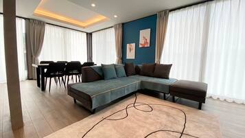 Deluxe Villa, Garden View | Living area | Flat-screen TV