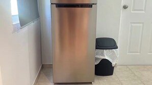 A stainless steel refrigerator in a corner of a room with tiled flooring and a white door. - 5 minutes from National Forest and 8 of the best beaches / Natural Essence (Luquillo)