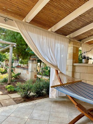 Deluxe Quadruple Room, Garden View | Terrace/patio