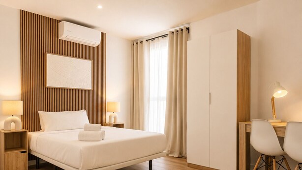 A modern hotel room with a bed, bedside tables, a desk, and a wardrobe. - Aparthotel Fuenlabrada Central (Fuenlabrada)