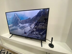 Apartamento conforto, sacada, vista para a praia | TV