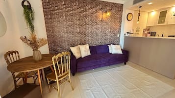 Comfort appartement | Woonruimte | Een flatscreentelevisie