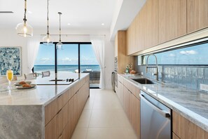 Fridge, microwave, oven, stovetop - Coastal Charm: Brand New Oceanfront Home w/ Pool, Backyard Snorkeling, + Designer Interiors (Grand Cayman)