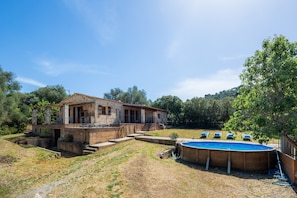 A house with a swimming pool, a covered patio, and a view of the surrounding landscape. - Holiday Home 'Enjoy Finca Son Galiana' with Private Pool, Wi-Fi and Air Conditioning (Illes Balears)