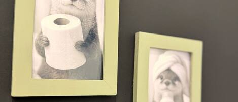 Two framed pictures on a wall.