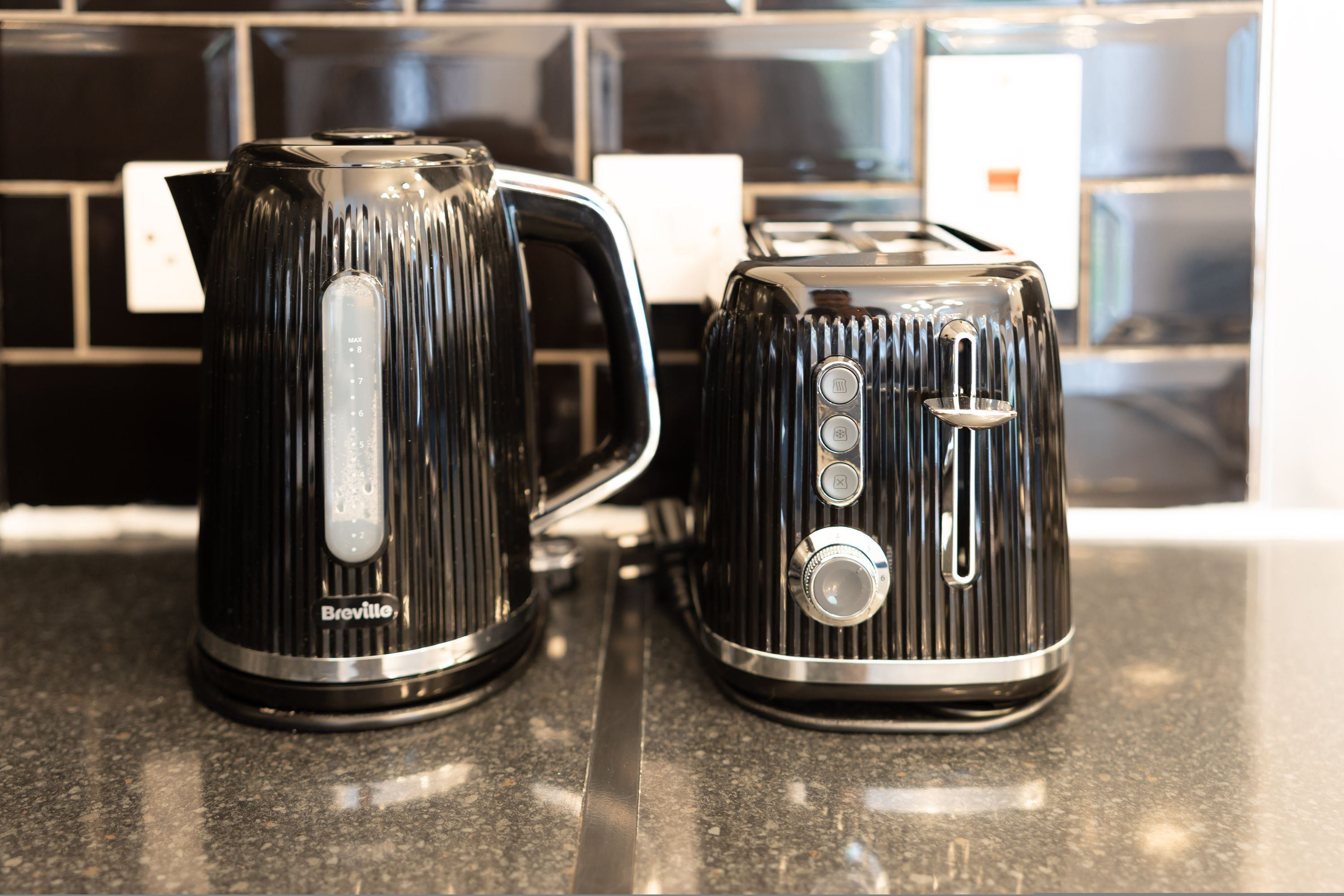 Two Breville electric kettles on a kitchen countertop.