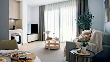 Family Apartment, Balcony | Living area | Flat-screen TV