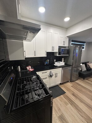Microwave, oven, stovetop, dishwasher - Spacious 2-bedroom Basement Suite Near West Edmonton Mall. (Edmonton)