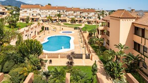 A resort with multiple buildings, a swimming pool, and lush landscaping. - AS EXT AL 2B1 3 1 in Mijas Costa (Mijas)