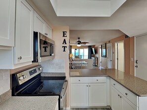 Fridge, microwave, oven, stovetop - Pointe South 503 | Gulf Views + Heated Pool (Fort Myers Beach)