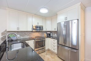 Fridge, microwave, oven, stovetop - Bayfront Condo with Pool (Ocean City)